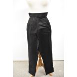 A pair of 1940s black cotton sateen trousers having high waist and hook and eye side fastening.