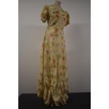 A 1930s floral evening gown having press stud fastening to side, sweetheart neckline, puff shoulders