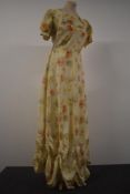 A 1930s floral evening gown having press stud fastening to side, sweetheart neckline, puff shoulders