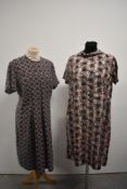 A 1950s autumnal print cotton day dress with bow to neck in a larger size and a 1950s wool check