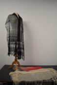 Two antique fringed shawls, one of black tulle and the other cream devore also included is a