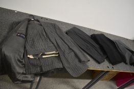 A gents grey wool pinstripe suit, around 1970s and a selection of trousers.