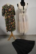 A vintage 1950s housecoat, a cotton and lace nightdress and a half slip.