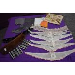 A mixture of vintage and antique items to include crotchet collars, hosiery case with forget me