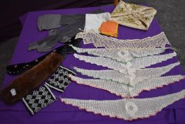 A mixture of vintage and antique items to include crotchet collars, hosiery case with forget me