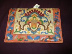 An Art Deco evening bag having embroidered pattern to front, internal compartments and mirror.