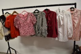 A collection of retro 1980s blouses and a jumper.
