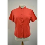 A 1950s cherry red blouse, 'Maxton regd Tricel fabric' bust size 36.