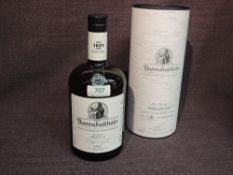 A bottle of Bunnahabhain Islay Single Malt Scotch Whisky, Feis Ile 2017 American Oak 1997, distilled