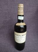 A bottle of 1960's Black & White Special Blend of Buchanan's Choice Old Scotch Whisky, by