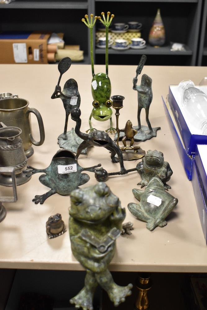 A selection of metal cast and stone carved frog and toad figures