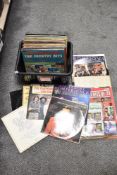 Two boxes of vintage vinyl albums and 75rpm singles