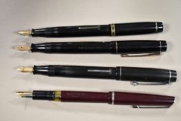 Four fountain pens. A Unique lever fill, a Summit Cadet Model 100, a Croxley lever fill and an