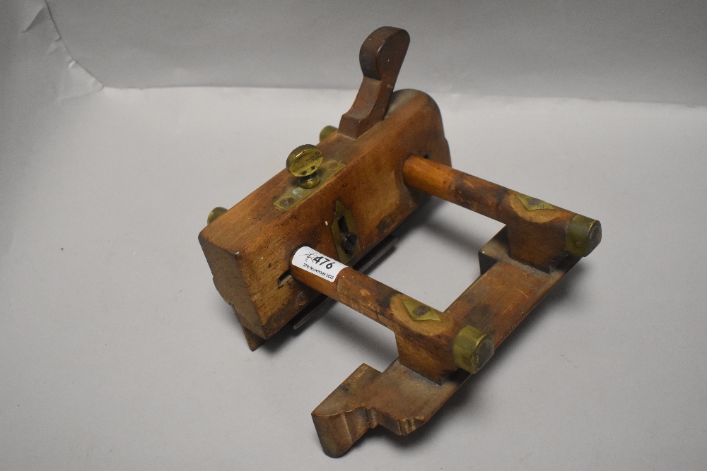 A Victorian beech wood moulding plane dated 1858 bearing makers name to brass plate and later names