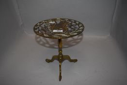 An antique brass cast fire side trivet stand with a squirrel design to top 20cm tall approx