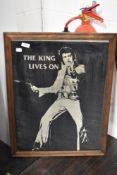 A framed mirror of Elvis Presley interest 'The King lives on'.