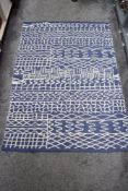 A vintage Afghan hand woven blanket in a heavy wool with blue geometric pattern 180cm x 125