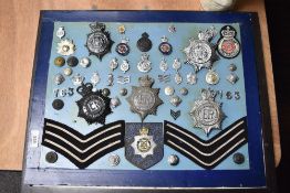 A selection of early and later 20th century Police Constabulary badges, buttons, pins and shoulder