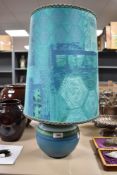 A mid century side or table lamp possibly by Denby having green and teal glaze with matching vintage