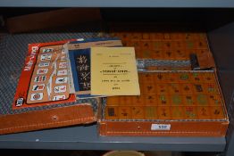 A 20th century Chinese Mah-Jong game and counter set with wooden games boards