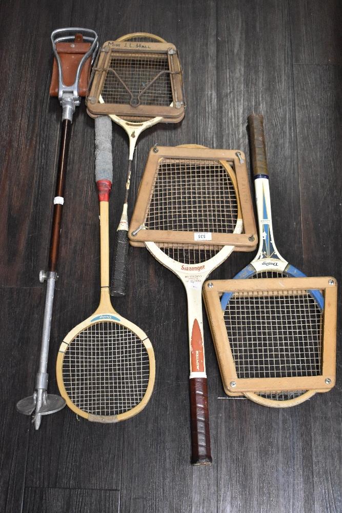 A selection of vintage tennis rackets including Slazenger and Dunlop. Also a shooting stick