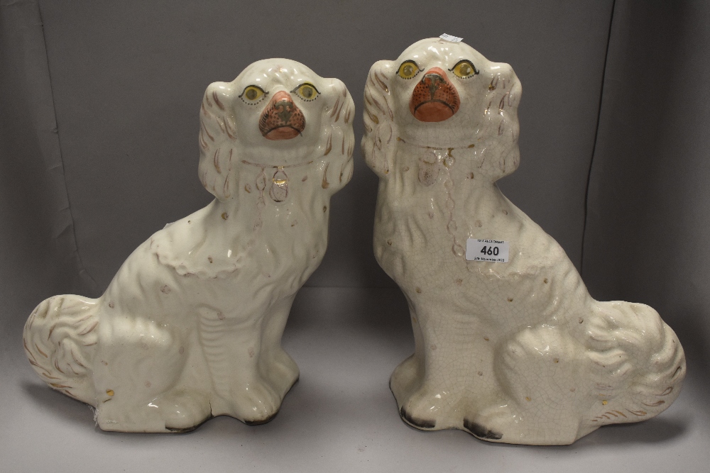A pair of Victorian Staffordshire flatback spaniel dog figures aprox 32cm tall