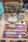 A selection of silver plated wares including shell and squirrel form bowl, decanter, candle sticks