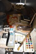 A selection of vintage artist supplies including ink pens, Ink bottles and a Page watercolour set
