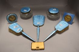 An Art Deco dressing table set having guilloche and enamel worked blue backs including two small