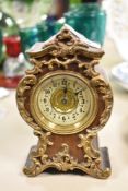 An antique French miniature travel clock having boulle style case, un tested.