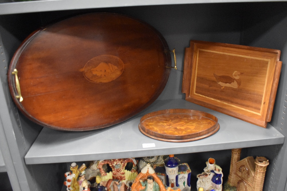 An 18th century small oval wooden tray with inlayed musical and wreath design also a similar era