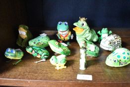 A selection of mid century and later tin plate clockwork frog and toad toys