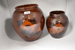 Two antique vase both having deep brown glaze with hand painted scenes of flowers