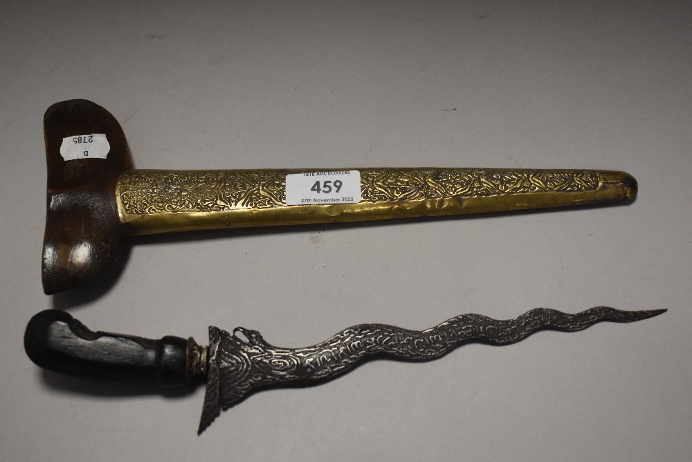 An early 20th century Kryss or sacrificial dagger having brass decorated sheath and engraved blade