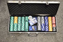 A cased set of Game On poker chips and cards