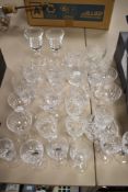 A mixed lot of vintage cut glass and crystal, including etched champagne glasses, tumblers and