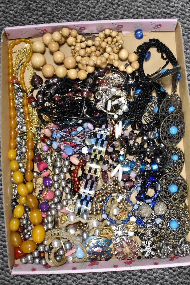 A selection of vintage costume jewellery including necklaces and bangles.