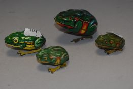 Four early 20th century tin plate toy frogs including DRGM and Kohler