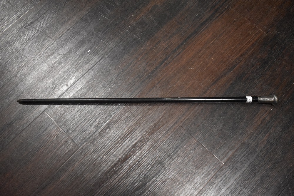 An early 20th century walking cane with ebonised shaft and white metal cap - Image 2 of 2