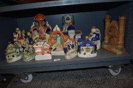 A selection of vintage and antique Staffordshire flat backs including Pastille burners, Spill