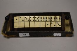 A vintage Avago domino game set with partial box.