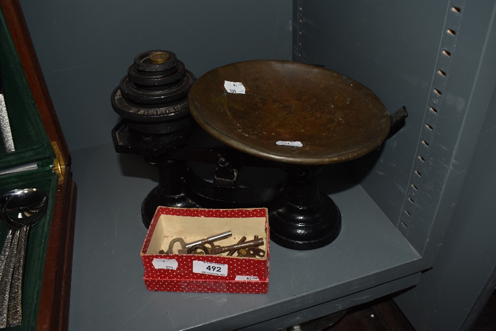 A set of Victorian kitchen weighing scales, cast with a brass pan and Victop weight set