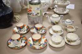 A selection of Art Deco ceramics including dolls house tea set, bowls and saucers and a pickle jar