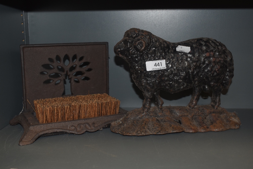 A Victorian cast iron door stop in the form of a Ram sheep