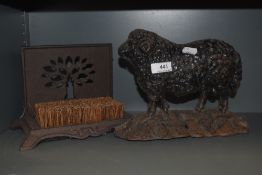 A Victorian cast iron door stop in the form of a Ram sheep