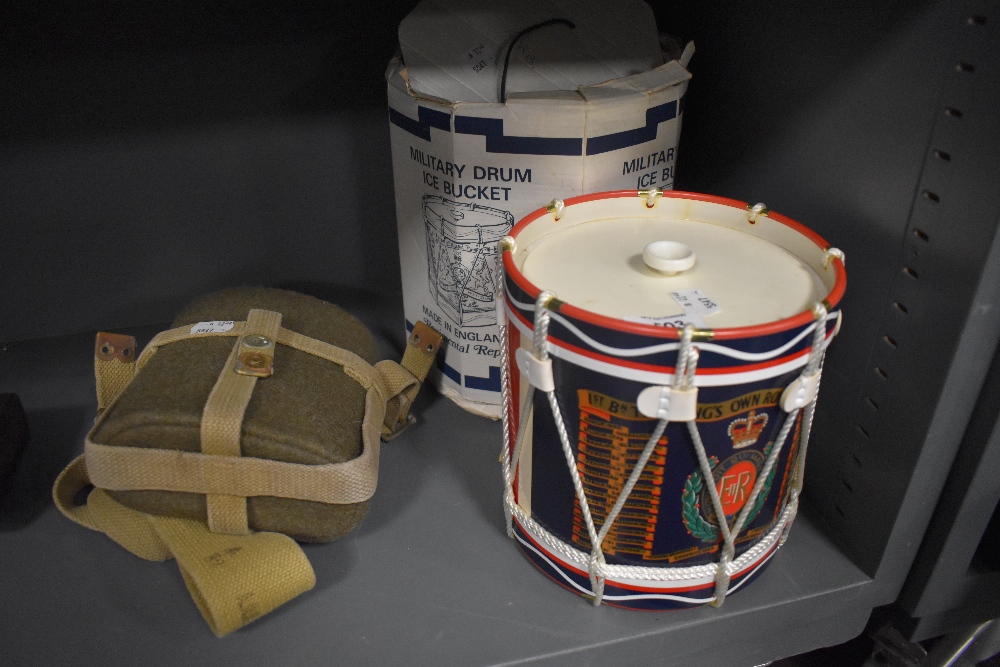 A vintage military water flask and a Military, Kings own border reg drum Ice Bucket