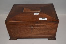 A fine Victorian sewing box of casket form with mahogany case having banded detailing and brass