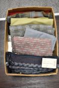 A box of textile fabrics for upholstery or haberdashery