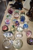 A selection of modern art glass paper weights including millefiori, lamp worked and hand blown.
