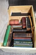 A vintage painted pine box with a selection of religious interest books.